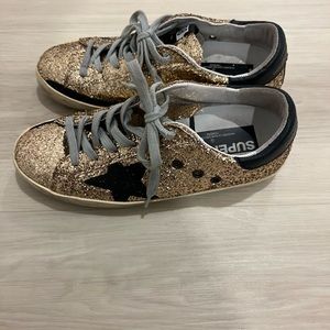 Golden Goose Black and Gold Glitter Deluxe Brand Sneaker